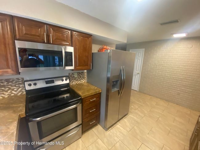 1392 Piper Rd, House other with 3 bedrooms, 2 bathrooms and null parking in SPRING HILL FL | Image 4
