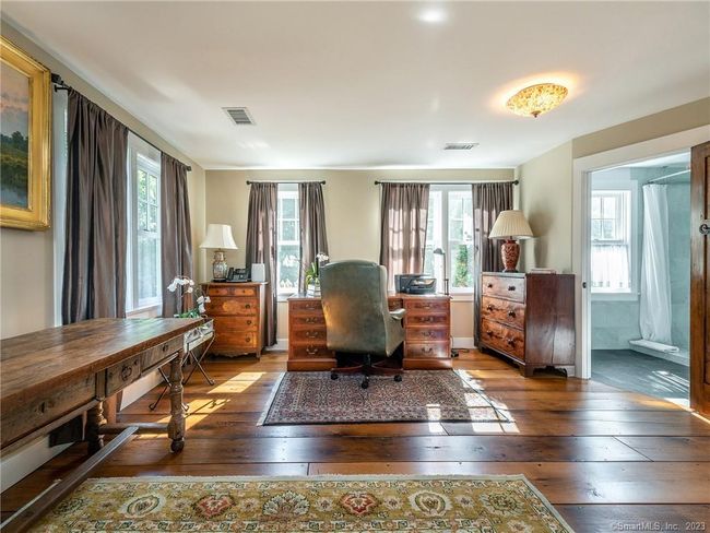 Main Floor Guest Bedroom. En-suite Bathroom with walk in shower. | Image 15