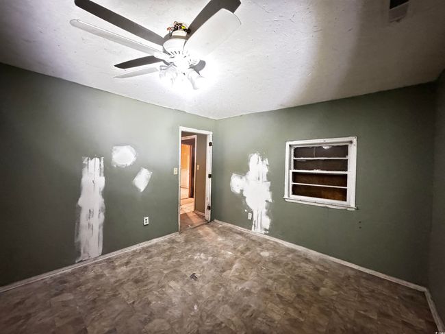 Unfurnished bedroom featuring ceiling fan and baseboards | Image 21