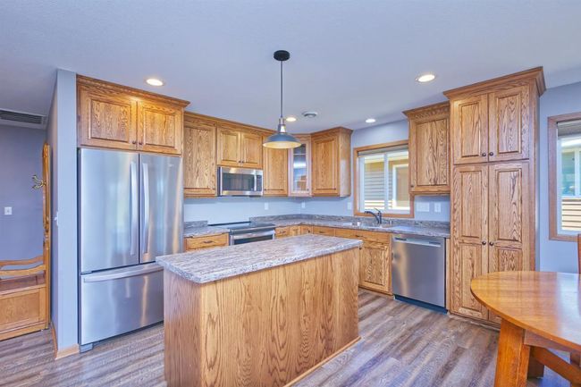 Kitchen with center island. Custom cabinets | Image 9