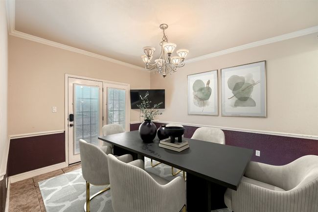 Dining area featuring crown molding, baseboards, tile patterned flooring, and a notable chandelier | Image 12