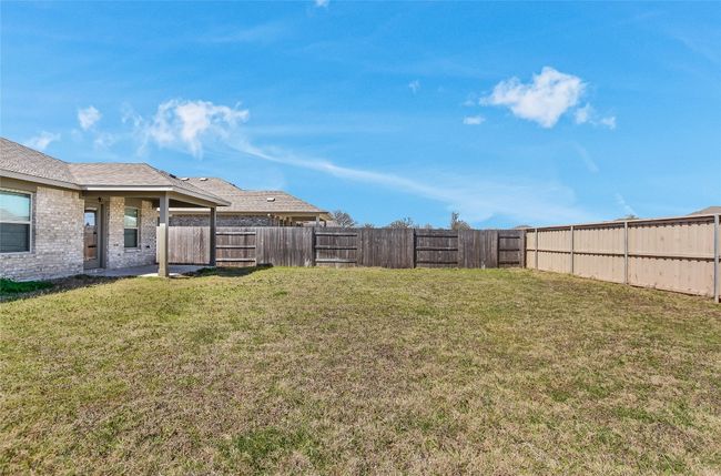 View of yard featuring a fenced backyard | Image 26