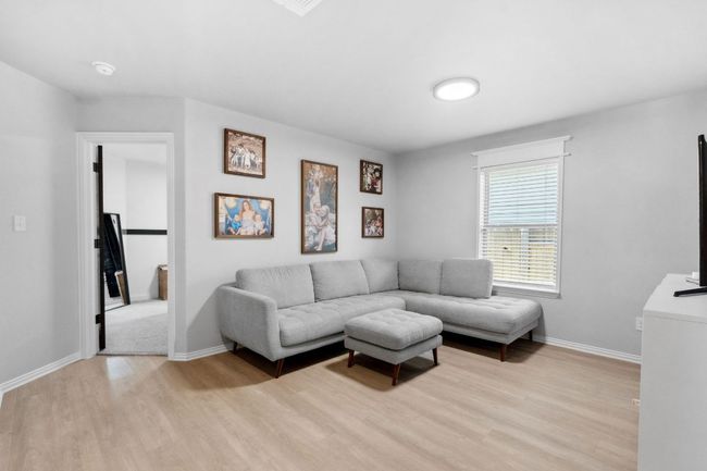 The third living space is set between two secondary bedrooms. | Image 23