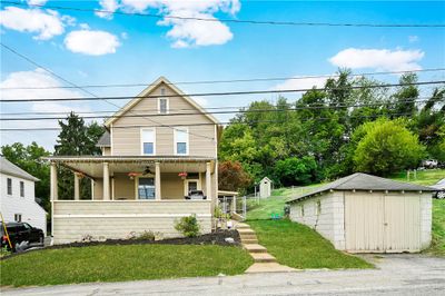 Close to the walking trail. detached garage and additional storage under porch | Image 1