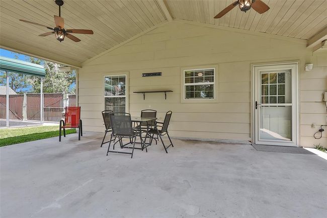 Another view of covered patio. Back entrance has storm door | Image 33
