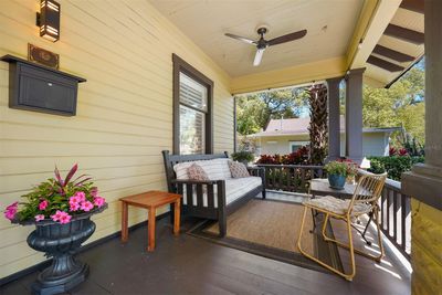 Expansive front porch perfect for gathering . . . | Image 3