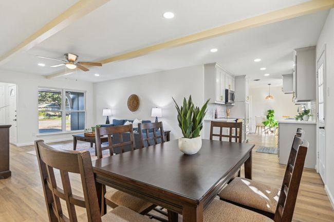Dining room with light wood-style flooring, ceiling fan, recessed lighting, and baseboards | Image 7