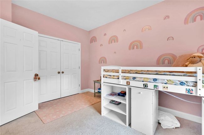 Guest bedroom with plush carpet. | Image 26