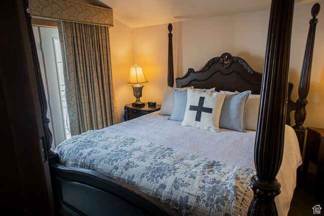 Bedroom featuring lofted ceiling | Image 13