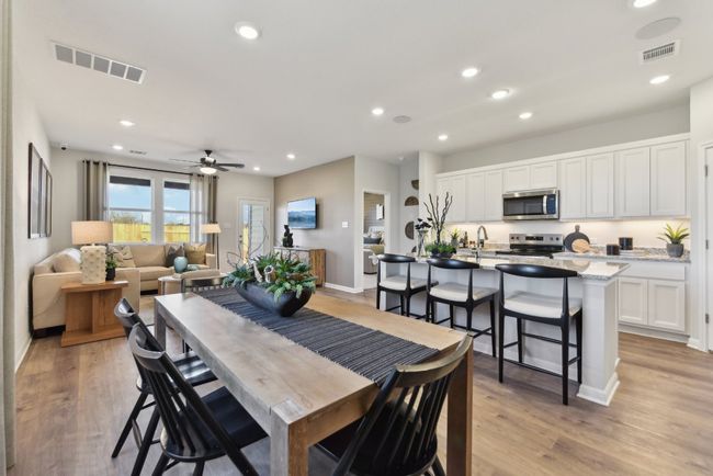 Dining area with ceiling fan, light wood-style floors, recessed lighting, and baseboards | Image 5