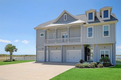 An exquisite 5/6 bedroom 5 bath waterfront setting providing 20, 530 SqFt of waterfront land with an opportunity to build a pool, putting green, sand volleyball court or many other options for your outdoor enjoyment. The views of West Galveston Bay are absolutely stunning! | Image 2