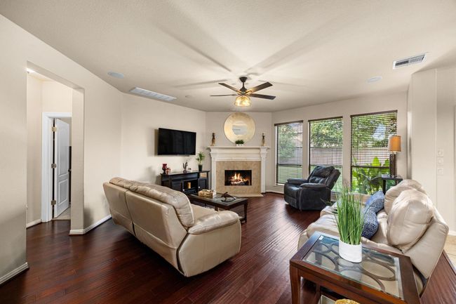 Very spacious living area with plenty of natural light. A fireplace to warm your living area and a surround sound system accompanies this common space. | Image 13