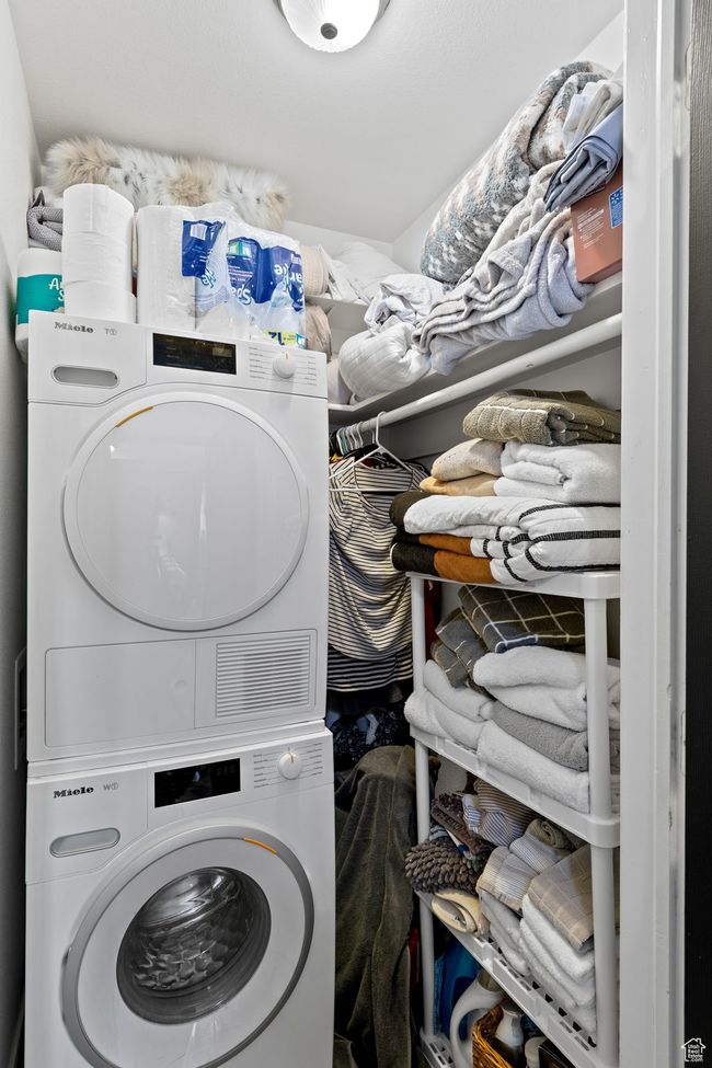 Laundry area with stacked washer / dryer | Image 11