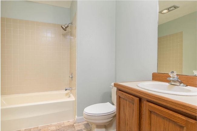 Bathroom with vanity and shower combination | Image 13