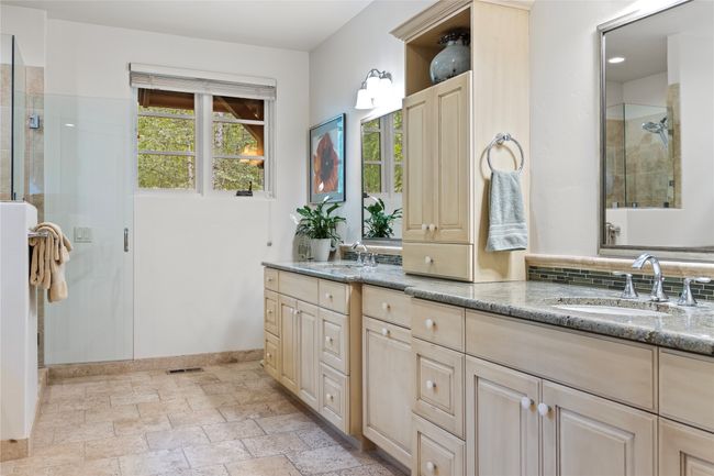 Very spacious primary bathroom with walk-in stone shower and soaking tub, double vanity. | Image 39