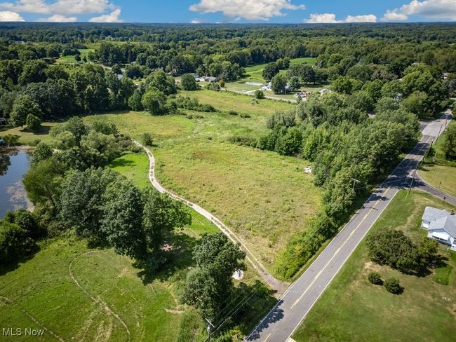 Birds eye view of property with a wooded view | Image 12