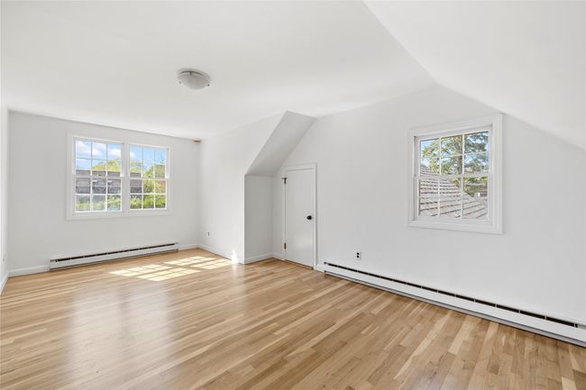 Bonus room with plenty of natural light, baseboard heating, a baseboard heating unit, and light wood-style floors | Image 15