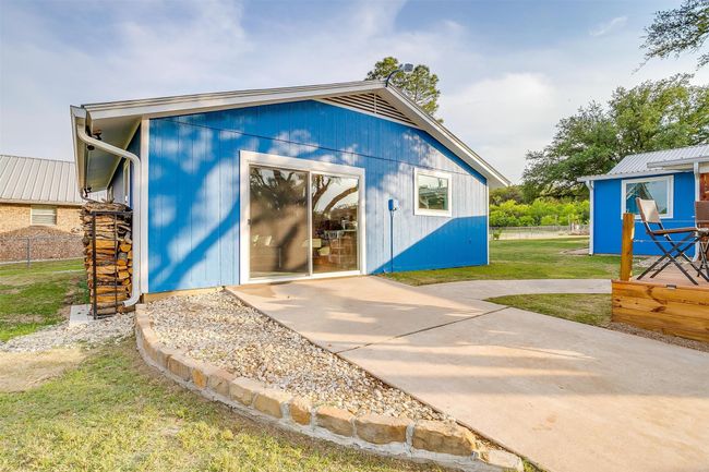 View of outdoor structure featuring fence and an outdoor structure | Image 13