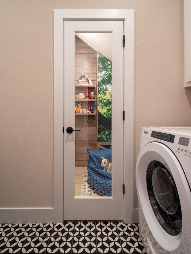 Laundry area featuring washer / dryer and a textured wall | Image 9