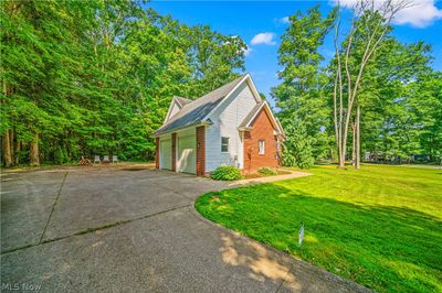 View of front of house with a garage and a front yard | Image 2