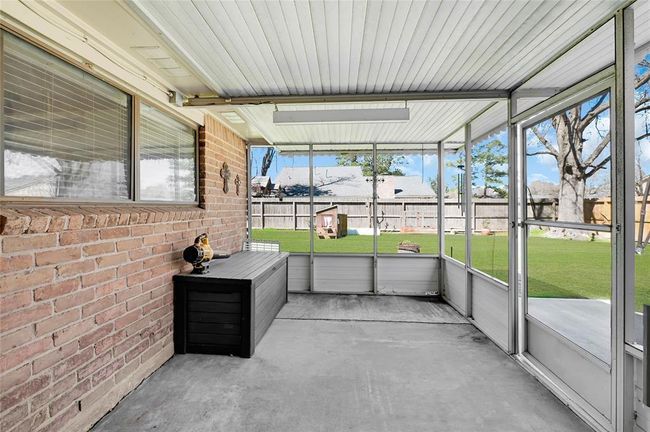 Bright enclosed sunroom ideal for summer relaxation and entertaining! | Image 24
