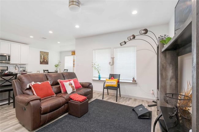 The dining area offers a light-filled setting for meals, with backyard views and seamless access to the kitchen and living spaces. | Image 5