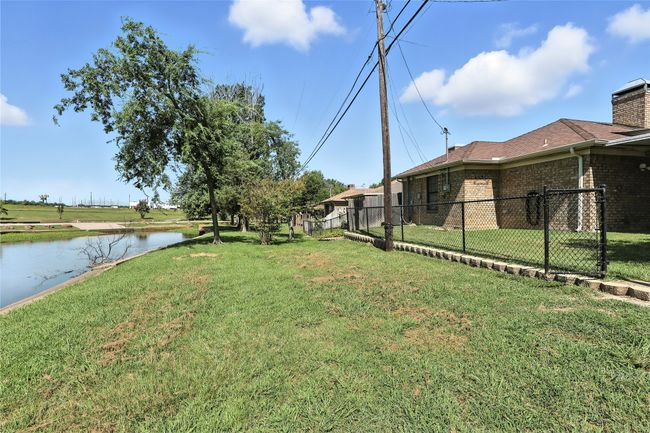 View of yard with a water view | Image 6