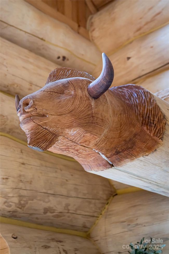 Artist Paul Hornbuckle carved two custom pieces directly into the log onsite during construction! | Image 17