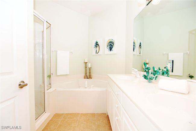 Relax and unwind in your spa-like primary bath. | Image 16