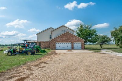 ide view of house with circle driveway in front | Image 3