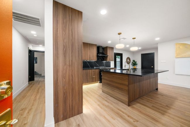 Enter in to a handsomely reimagined space; island can seat 4 | Image 6