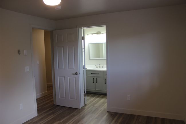 Empty room with baseboards and wood finished floors | Image 14