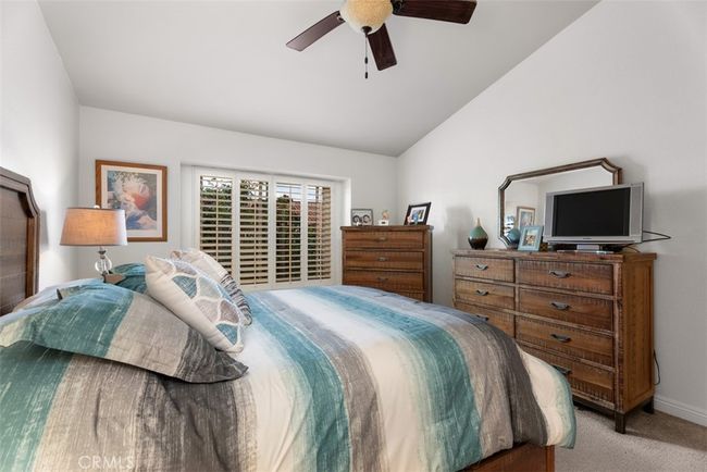 The primary bedroom comes complete with a ceiling fan, great for those warm summer nights | Image 25