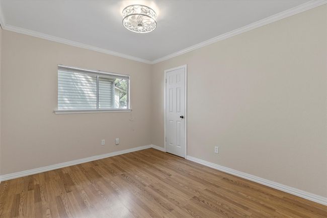 Each guest bedroom is spacious and features vinyl plank flooring | Image 15