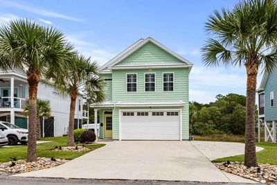 View of front facade with a garage | Image 1