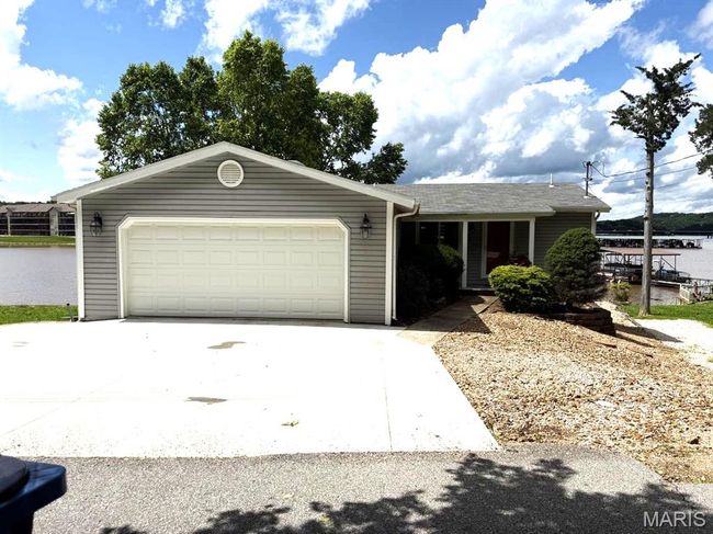 Garage featuring a garage door opener | Image 4