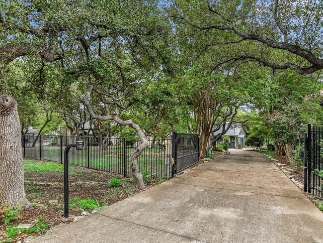 View of gate featuring a fenced front yard | Image 23