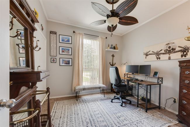 Office area with baseboards, ceiling fan, ornamental molding, and carpet floors | Image 24