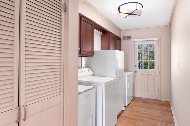 Mudroom featuring large pantry, washer/dryer and storage | Image 18