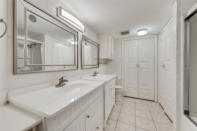 Full bathroom with vanity, tile patterned floors, a shower. | Image 20