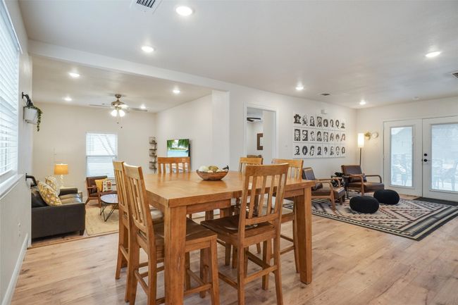 Dining area with light hardwood / wood-style floors, french doors, and ceiling fan | Image 4