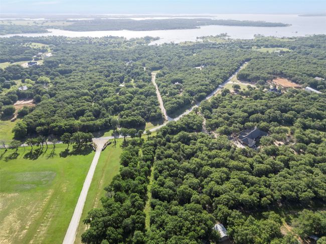 Aerial view of a nearby body of water and a forest | Image 5