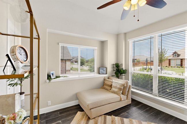 pr 4th bedroom with plenty of natural light, dark wood-style flooring, baseboards, and ceiling fan | Image 30