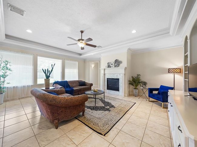 Cozy living room bathed in natural light. | Image 14