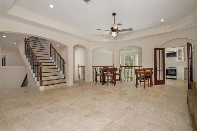 The spacious game room upstairs can host large gatherings for billiards, ping pong or family game night! | Image 26