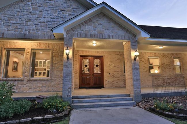 Step up to this gorgeous porch. Plenty of room for your outdoor furniture! | Image 7