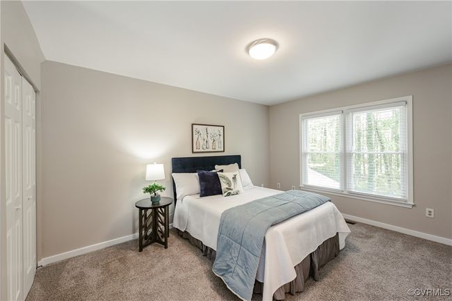 Bedroom 2 with a closet, carpet flooring, and baseboards | Image 35
