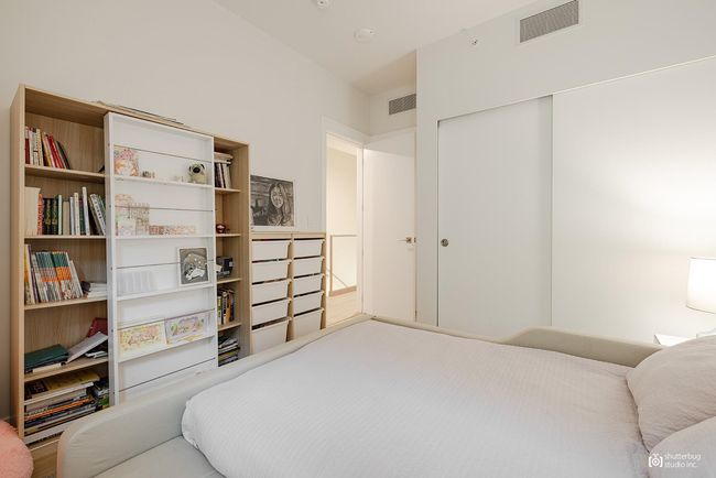 Bedroom with visible vents and a closet | Image 16