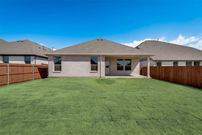 Rear view of property with a lawn and a patio | Image 24