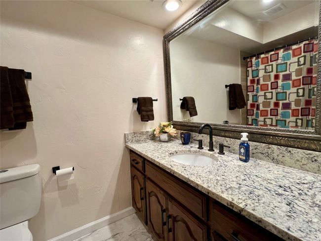 Full bathroom featuring vanity and marble finish floors | Image 16